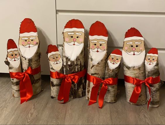 papais noel feitos com troncos de arvores 1